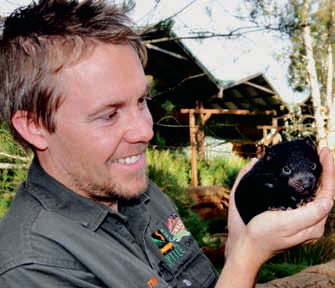 Tim with one of the Tassie Devil babies. Photo courtesy of Devil Ark